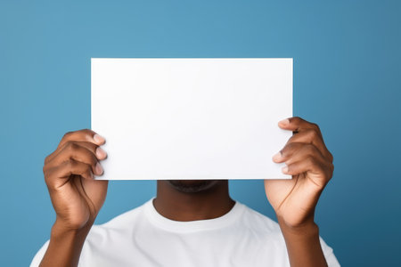 Holding a white piece of paper, holding a blank white piece of blank picture frame with both hands, AI generatedの素材