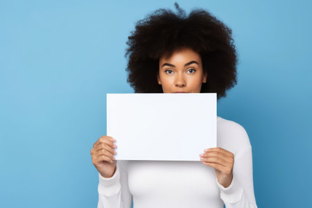 A woman holding a white piece of paper, holding a blank white piece of blank picture frame with both hands, AI generatedの素材