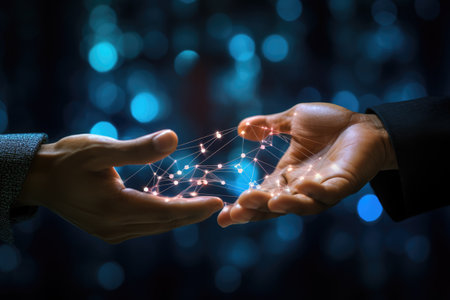 Close up of businessman hand holding flying network hologram on dark background, learning hands of a robot and a human touching on a big data network connection, Ai generatedの素材