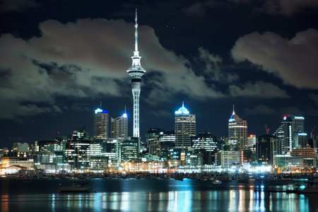 Auckland skyline with the Sky Tower illuminated at night AI generatedの素材