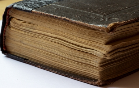 old book with yellowed leaves on a white backgroundの写真素材