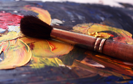 brush on colorful abstract background drawn by oil paints の写真素材
