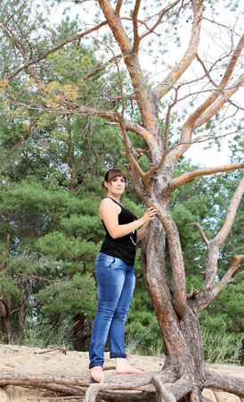 Beautiful woman near the treeの写真素材