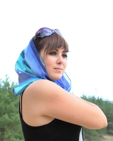 Beautiful woman in the bright headscarfの写真素材