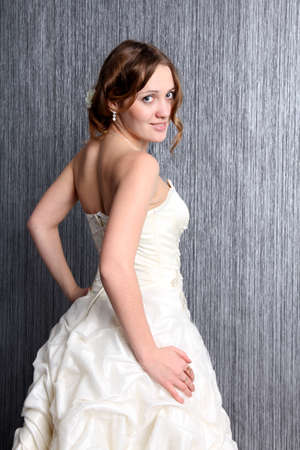 Portrait of the young blond woman in the white dressの写真素材