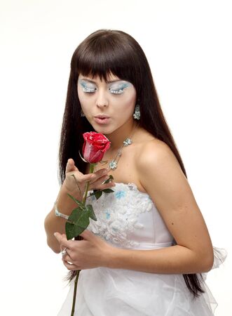 woman in a snow queen with iced roseの写真素材