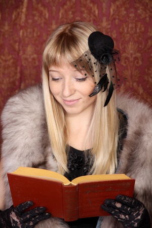 The Retro woman reading interesting bookの写真素材