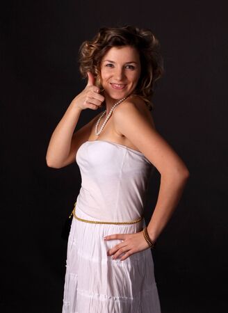 The young smiling woman in white dressの写真素材