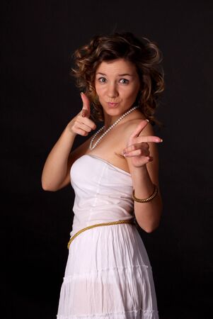 Young beautiful girl pointing her hands forwardの写真素材