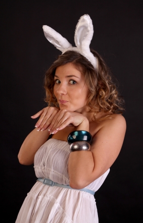 Attractive young blond girl with bunny earsの写真素材