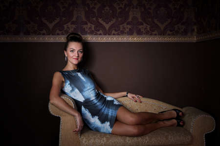 The elegant lady on the sofaの写真素材