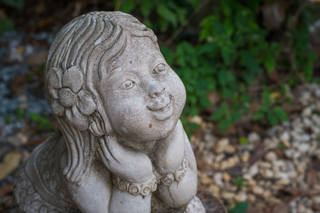 Happy Asian Girls stone statueの写真素材