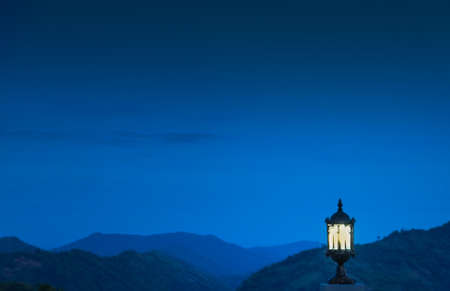 Mountains, clouds, mist and the night sky are beautiful with lanterns, giving a feeling of loneliness.の写真素材