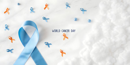 World Cancer Day concept. Blue ribbon on white marble background with clouds.の写真素材