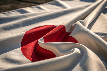 Closeup of the national flag of Japan blowing in the wind.の写真素材