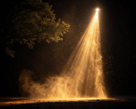 Spotlight in the dark. The rays of light make their way through the dust.の写真素材