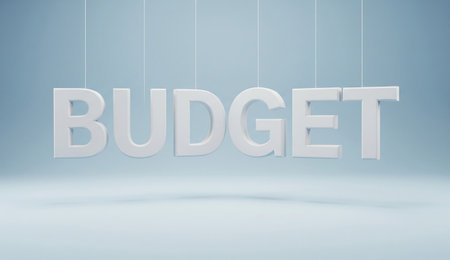 the word budget is spelled out in large white letters hanging from strings with a light blue background in the imageの写真素材