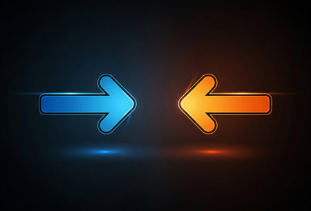 a blue right arrow and an orange left arrow glow against a dark gradient backdropの写真素材