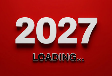 the image shows the year 2027 in white with loading text on a red backgroundの写真素材