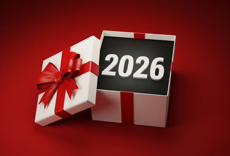 a white gift box with a red ribbon and the year two thousand and twenty six inside it