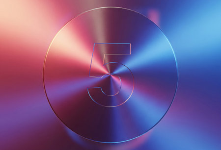 a metallic circle with the number five inside illuminated by neon lights effectの写真素材