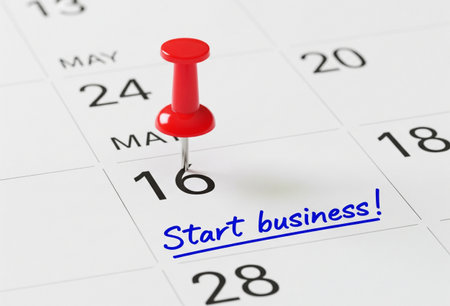 a calendar with a red pin marking the start date for a new business plan