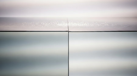 Water surface boundary line Calm liquid level meeting a mirror like division Clean geometric reflection background concept.の写真素材