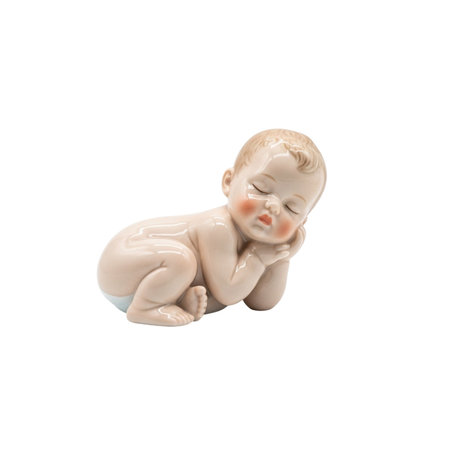 Porcelain figurine sleeping baby. Adorable infant sculpture. Innocent child art isolated on white background.の写真素材