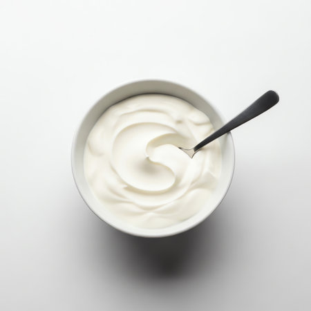 Top view of smooth Greek yogurt, sour cream, and mayonnaise in white bowlの写真素材