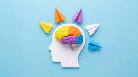 Mind and brain creativity and innovation concept. Colorful brain illustration with paper airplanes depicts new ideas and imagination.の写真素材