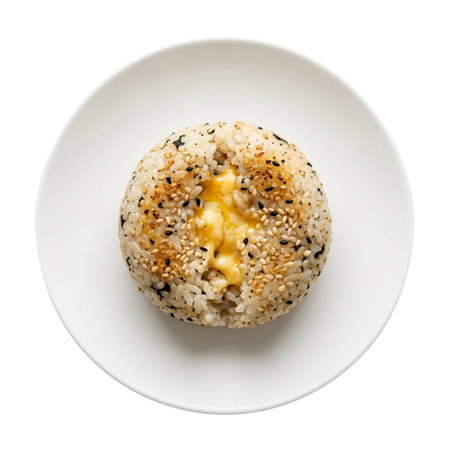 Yaki onigiri with charred surface for extra flavor. Roasted rice ball served as warm appetizer on ceramic dishware.