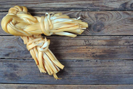 Smoked braided cheese close - upの写真素材