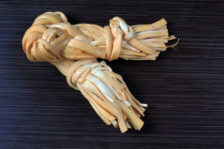 Smoked braided cheese close - upの写真素材