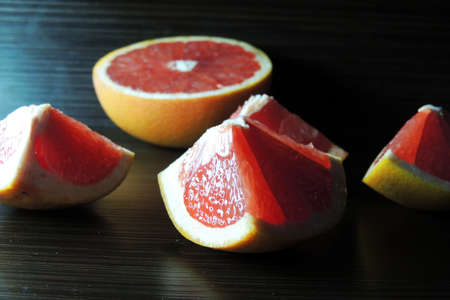grapefruit on a wooden background. food, fruitの写真素材