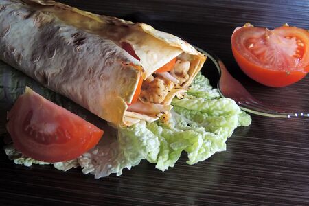 chicken kabob with salsa and yogurt on a flatbread