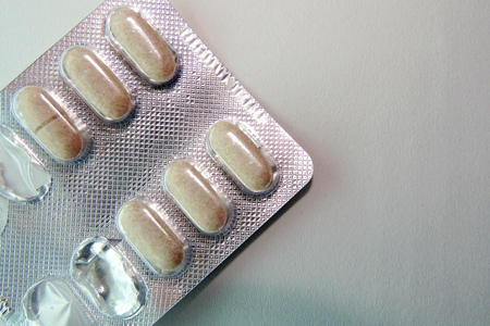 Medical pill tablet isolated on white, clipping path includedの写真素材