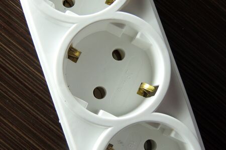 A power cord used conceptually on a white backgroundの写真素材