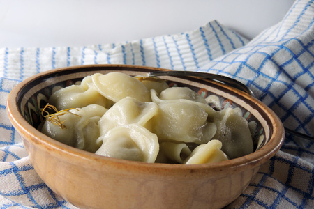 Making homemade ravioli with a wooden rollerの写真素材