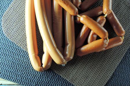 Variety of sausage products on wooden backgroundの写真素材