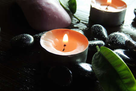 Zen stones and aromatic candles on table,Zen concept.の写真素材