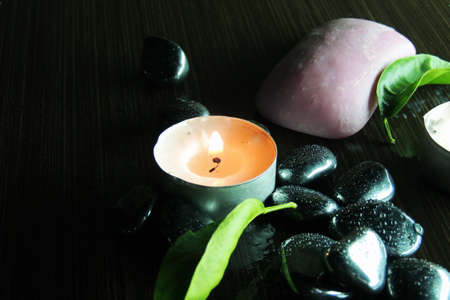 Zen stones and aromatic candles on table,Zen concept.の写真素材