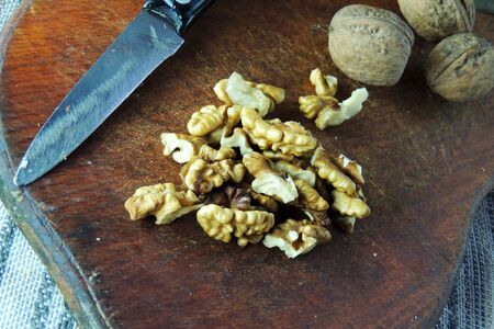 Walnuts. Whole walnuts, walnuts kernels and nutcracker.