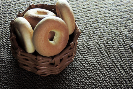 Variety of fresh bagels on rustic wooden backgroundの写真素材