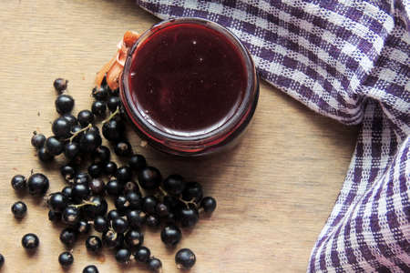 Delicious black currant jam on table close-upの写真素材