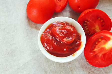 Fresh homemade tomato sauce in a white bowlの写真素材