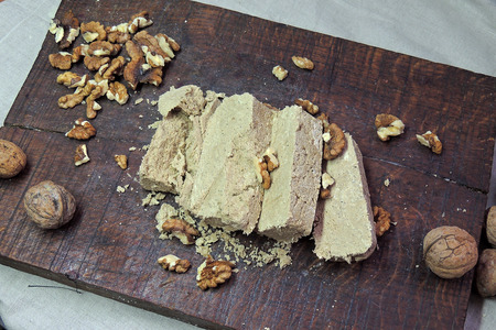 Halva Slices with Peanut on a wooden surface.の写真素材