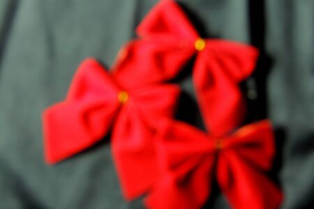 Shiny red satin ribbon on white backgroundの写真素材