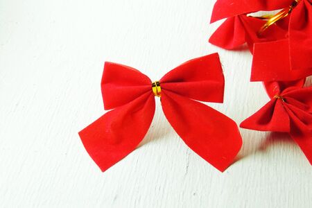 Shiny red satin ribbon on white backgroundの写真素材