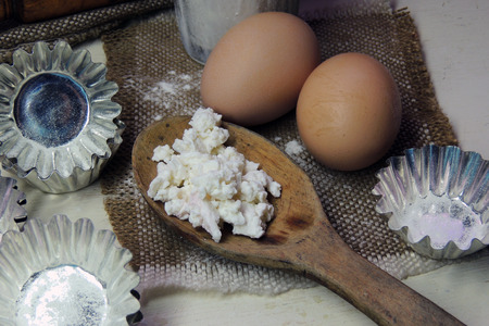 Ingredients for cupcakes: flour, forms, eggs, rolling pin sugar curd and differentの写真素材