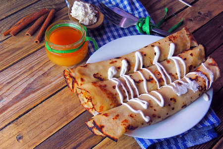 Rolled pancakes with cottage cheese and poppy seedsの写真素材